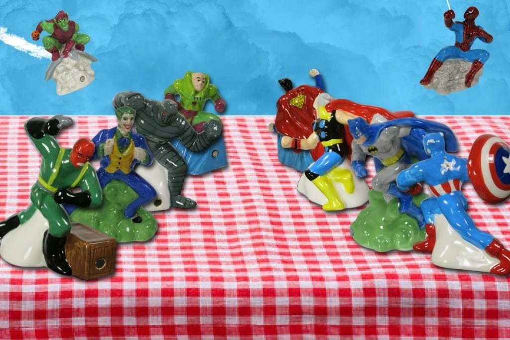 A table displaying comic book salt and pepper shakers