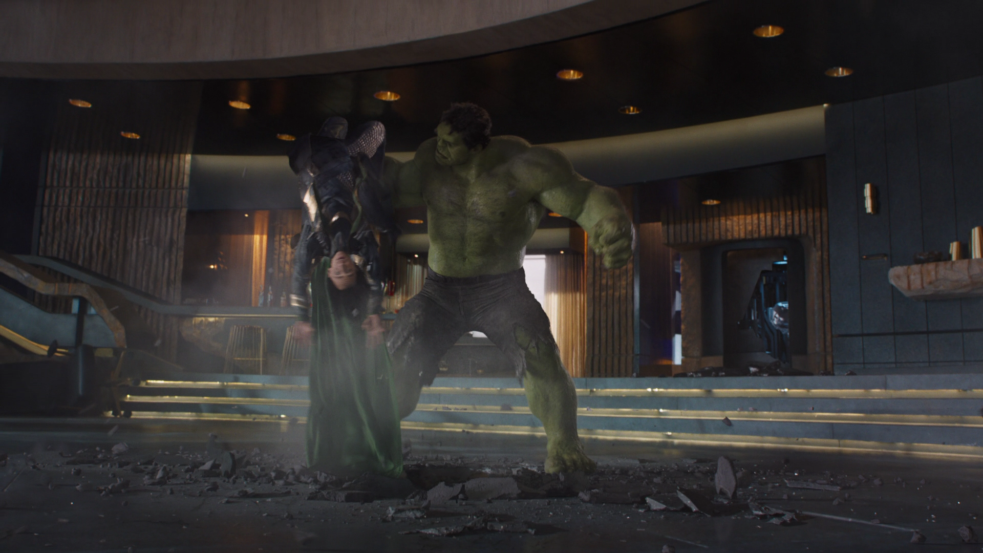 Hulk smashes Loki into the ground. 